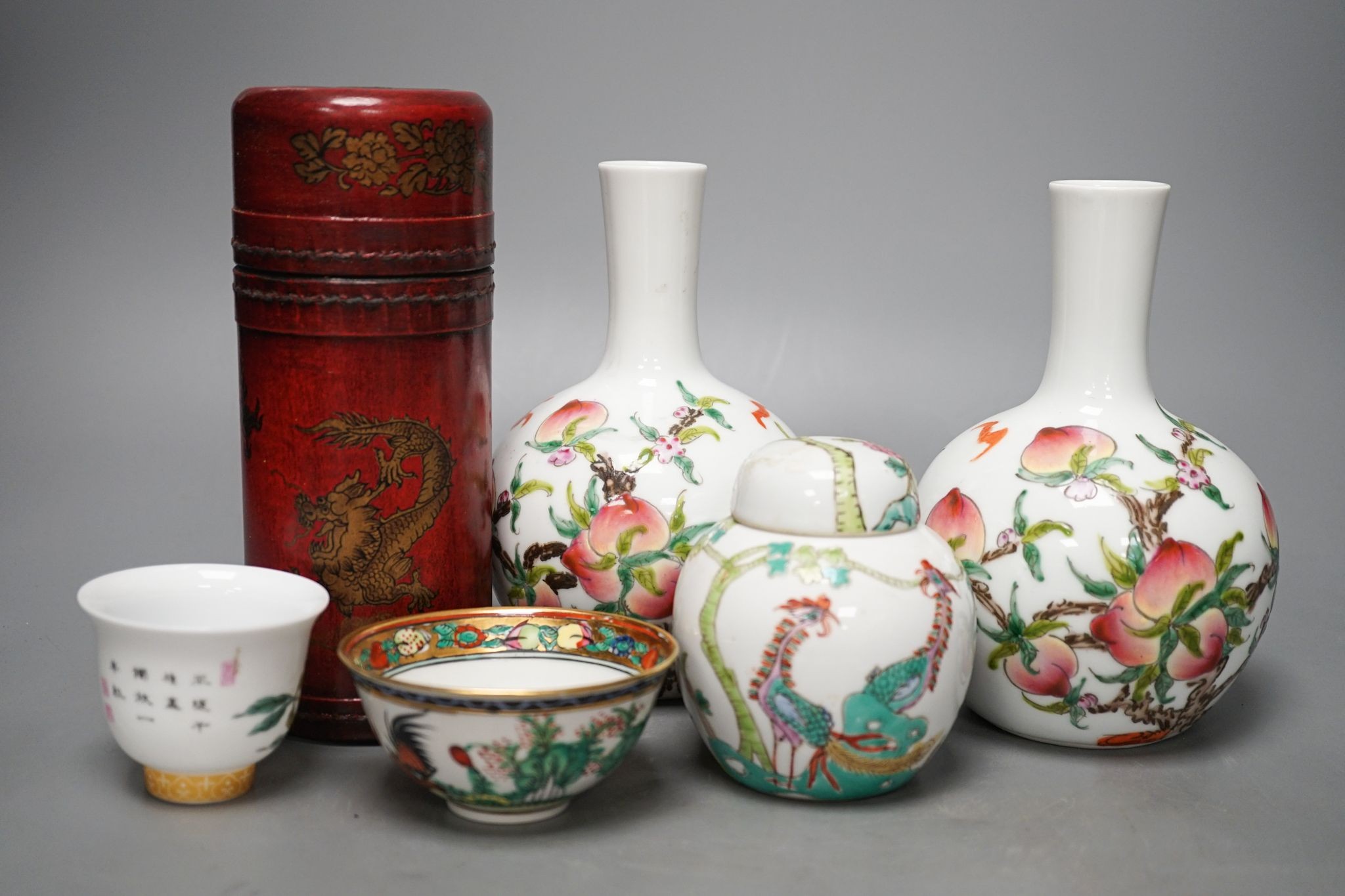 A pair of Chinese famille rose ‘peach’ bottle vases, 17cm, a ‘phoenix’ jar and cover, two porcelain cups and a boxed set of bamboo tallies or counters (6)